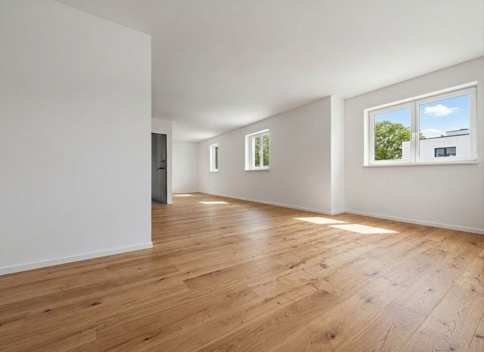 Stilvolle Neubau-Reihenendhäuser in München-Allach: Realteilung, KfW-55 und flexibler Grundriss